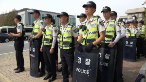 south-korean-police-officers-stand-guard-in-front-of-the-national-assembly-building-in-seoul_siw-86blx_thumbnail-full01-300x169.png