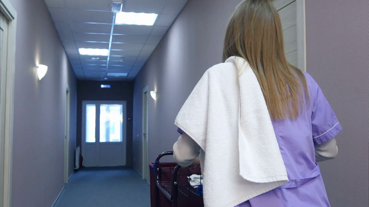 videoblocks-young-female-maid-pushing-cart-while-cleaning-hotel-rooms_rm8qh-1536427650355.jpg