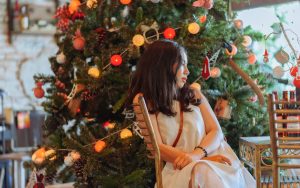 woman-wearing-white-dress-sitting-near-christmas-tree-1143000-300x188.jpg