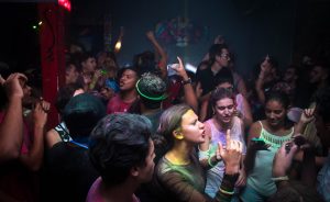 crowd-dances-in-blue-painted-enclosure-1154189-300x184.jpg