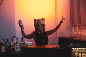 person-wearing-mask-holding-cocktail-shaker-1230397-300x199.jpg